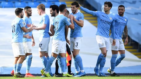 GROUP HUG: The players gather to congratulate Dias and De Bruyne after the opener.