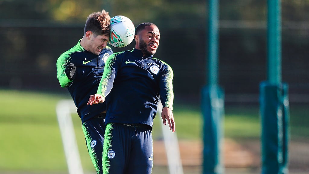 HEAD BOYS: John Stones rises with Raheem Sterling to contest this aerial challenge