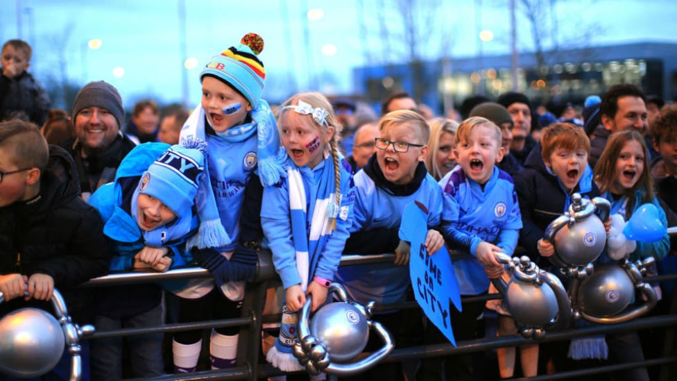 CUP FOR IT : These young fans were thrilled to be at the Etihad