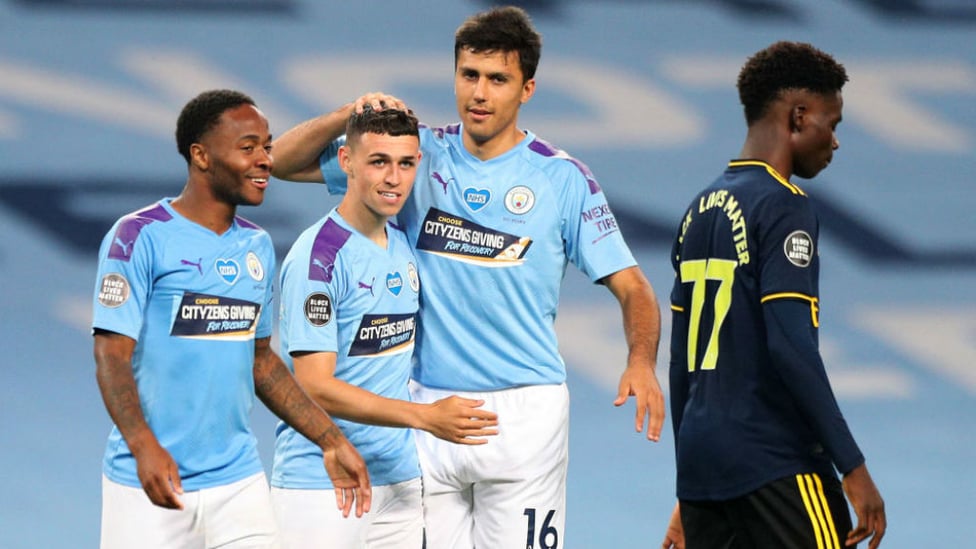 THREE CHEERS: Phil Foden celebrates with Raheem Sterling and Rodri after his late goal