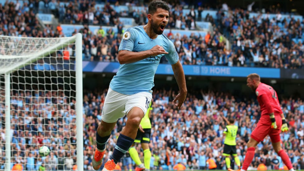 TERRIERS TERRORISED : Sergio Aguero celebrates the first of six City goals against Huddersfield Town