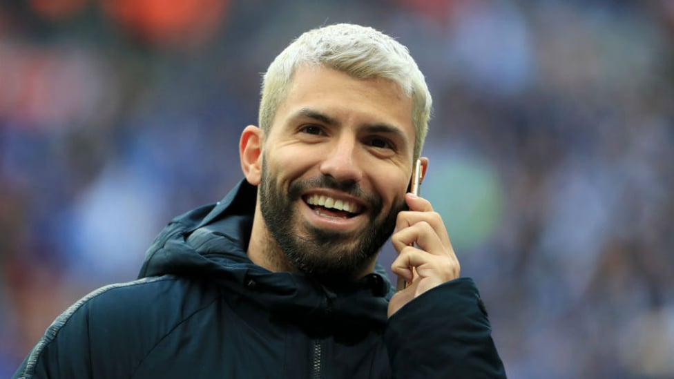 PHONE A FRIEND TIME : Sergio Aguero, who wasn't quite ready for selection, cuts a relaxed figure prior to kick-off