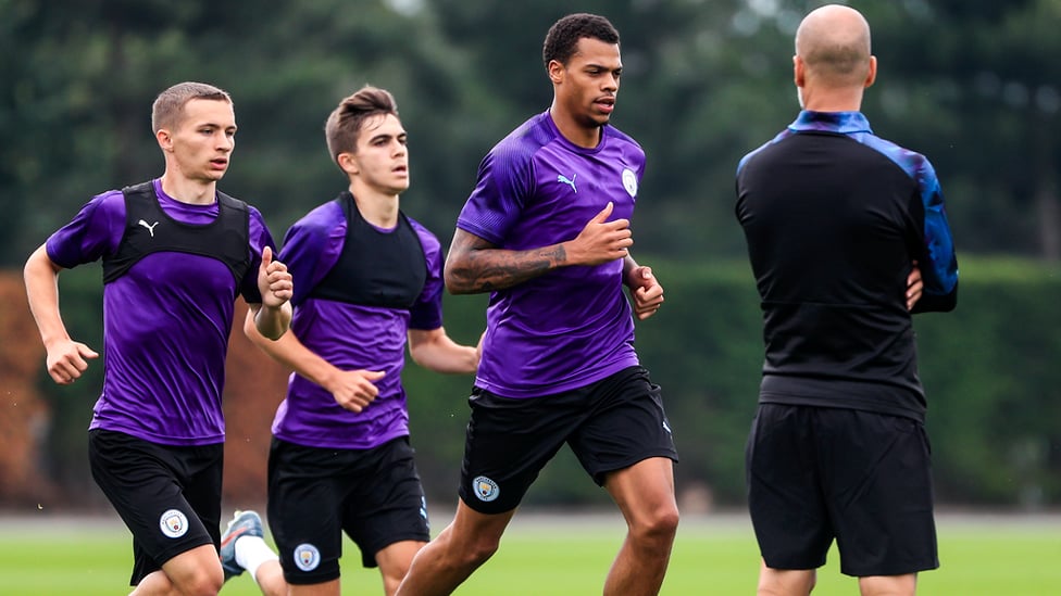 ON THE RUN : Lukas Nmecha is put through his paces as the boss oversees Tuesday's session
