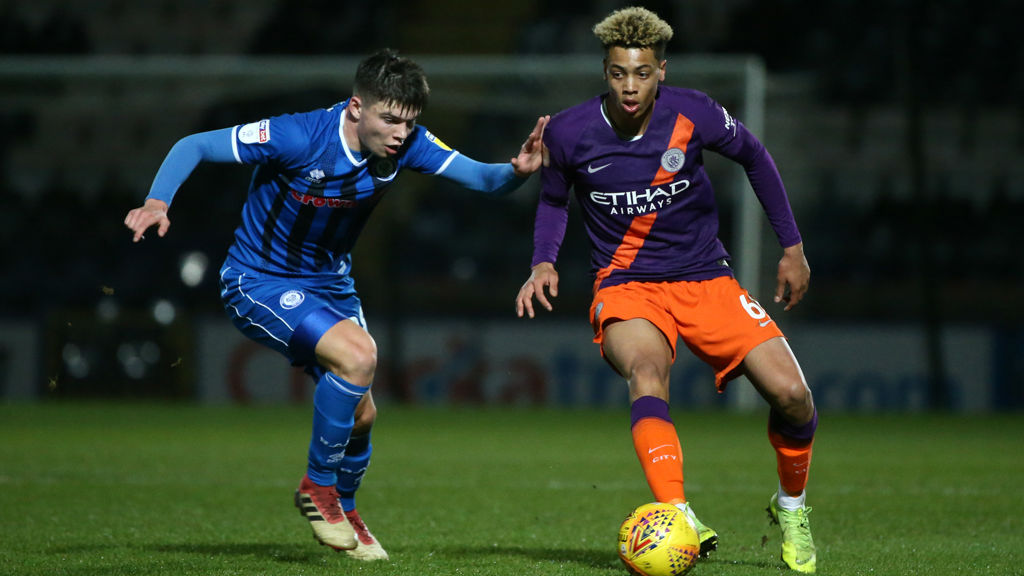 FRONT FOOT : Felix Nmecha takes on the Rochdale defence as he looks to launch another City attack