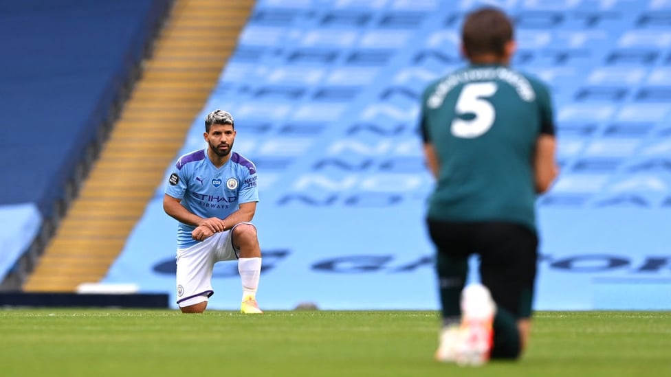 POWERFUL MESSAGE : Aguero and co take a knee before kick off to honour the Black Lives Matter movement.