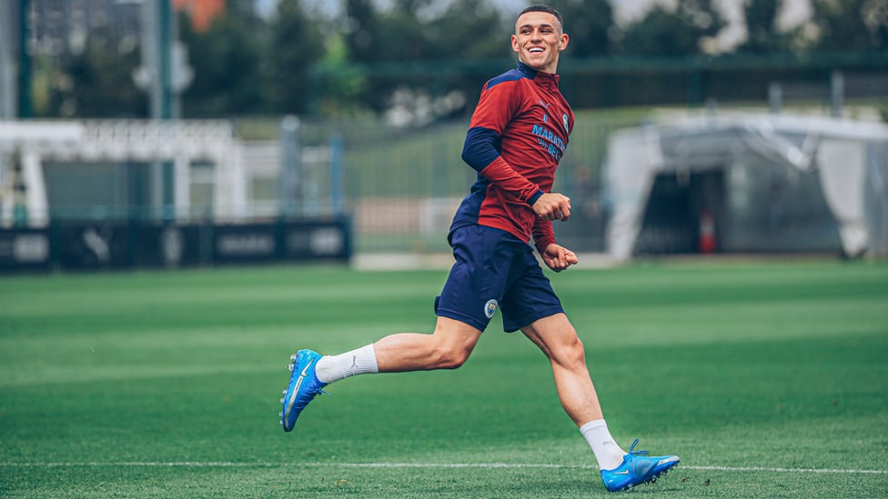 ONE OF OUR OWN : Phil Foden enjoying his afternoon on the CFA grass.