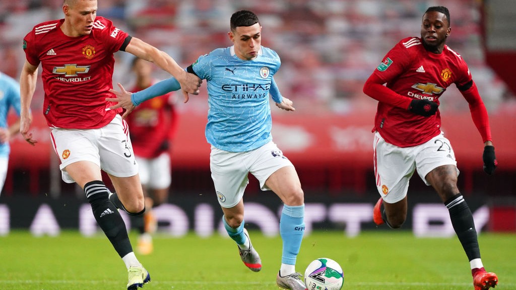 FLYING PHIL: Our midfielder races away from Scott McTominay and Aaron Wan-Bissaka