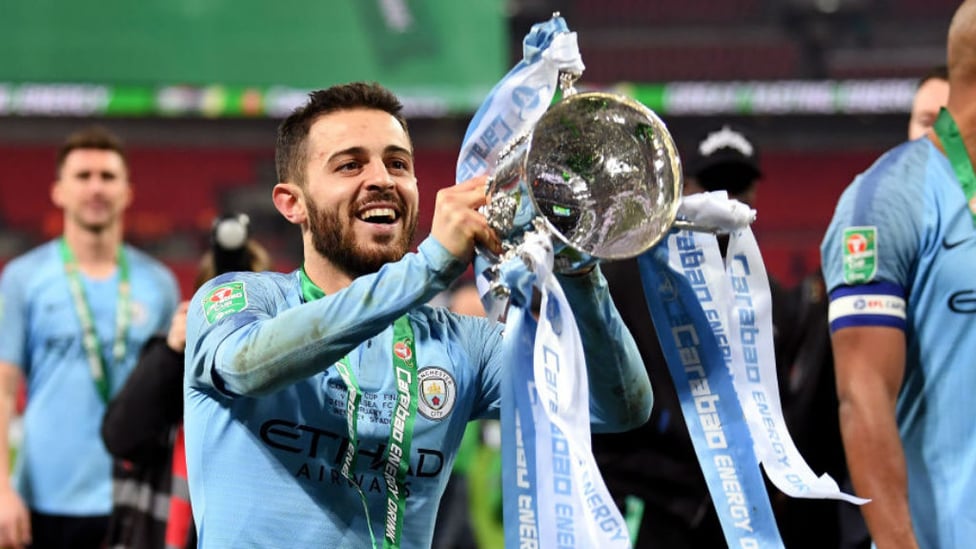 SILVA DREAM MACHINE : Bernardo lifts the Carabao Cup aloft again after our dramatic penalty shoot-out win over Chelsea last month