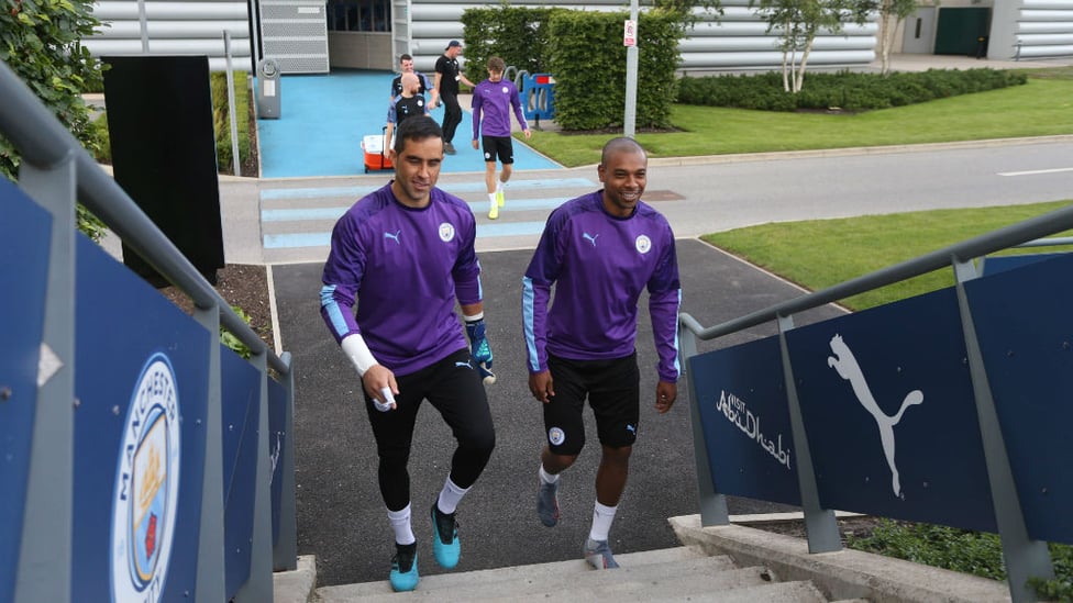 OFF TO WORK : Claudio Bravo and Fernandinho make their way to training