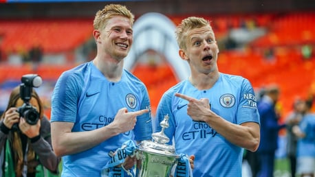 IDENTICAL: Oleksandr Zinchenko and KDB strike a pose