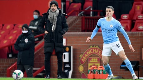 THE BOSS: Pep Guardiola watches on from the touchline