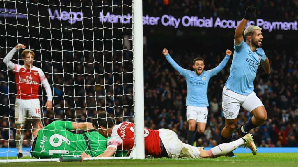 
                        OUT OF SIGHT : Aguero scrambles the ball over the line to secure hat-trick.
                