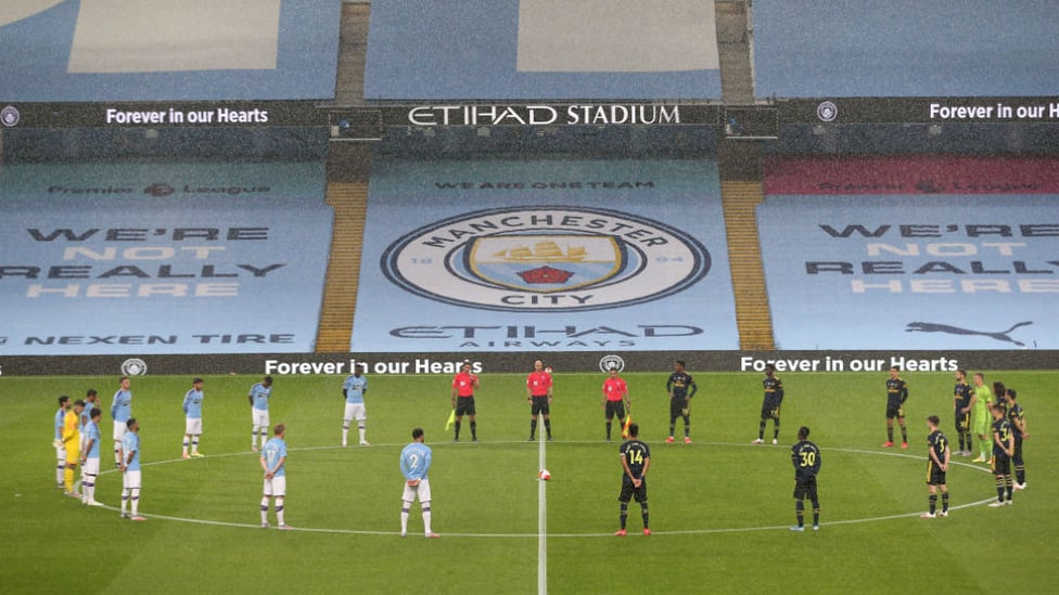 POIGNANT PICTURE: The teams took part in a minute's silence before kick-off 