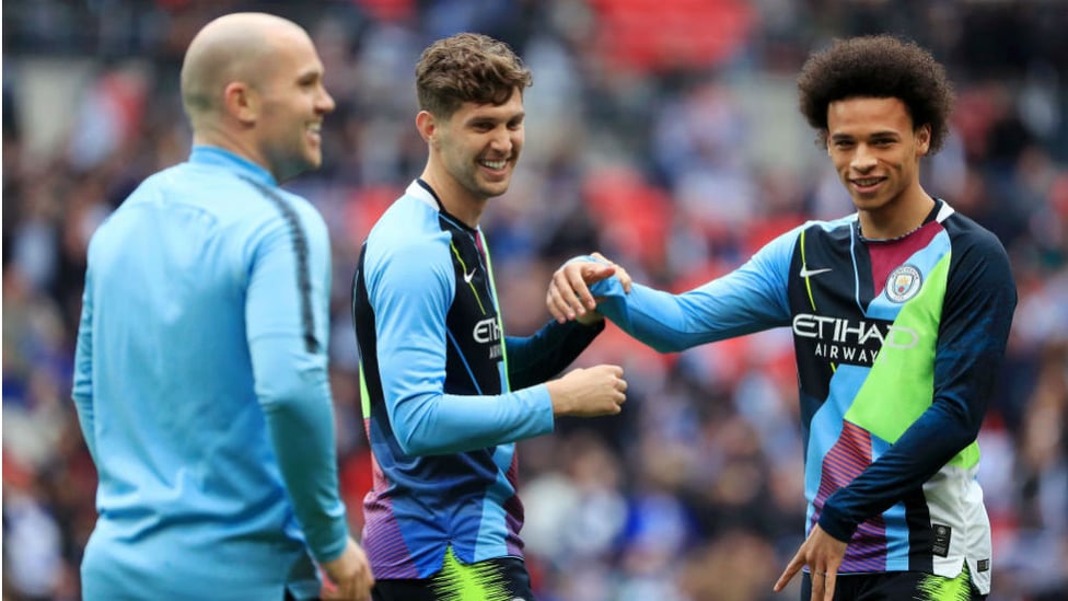 MASH IT UP : John Stones and Leroy Sane both cut quite a dash during the warm-ups in our Nike celebration mash-up jersey