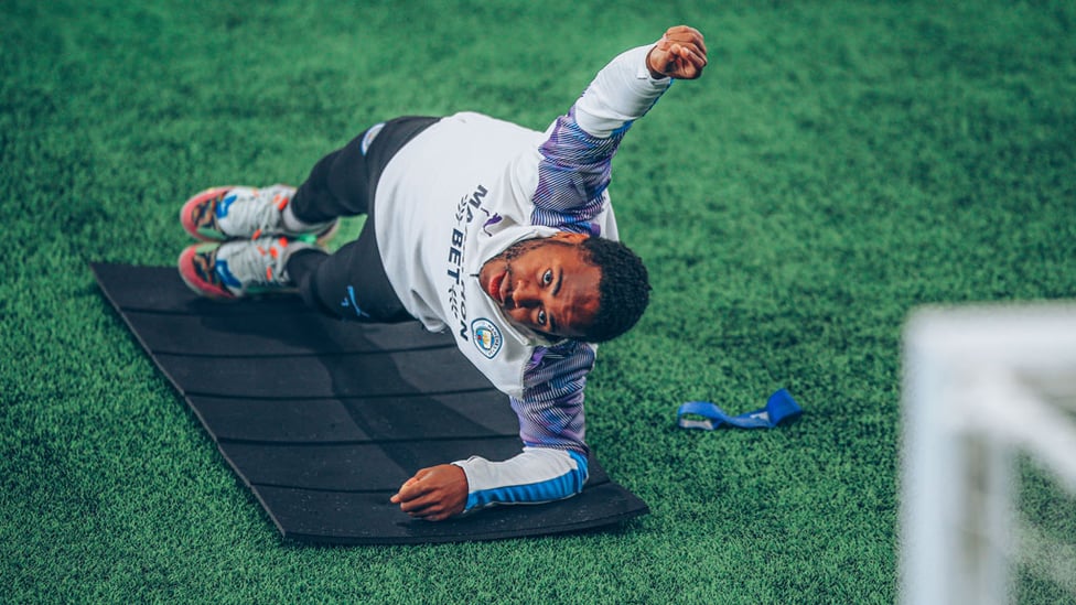 AT FULL STRETCH: Raheem Sterling goes through an exercise routine