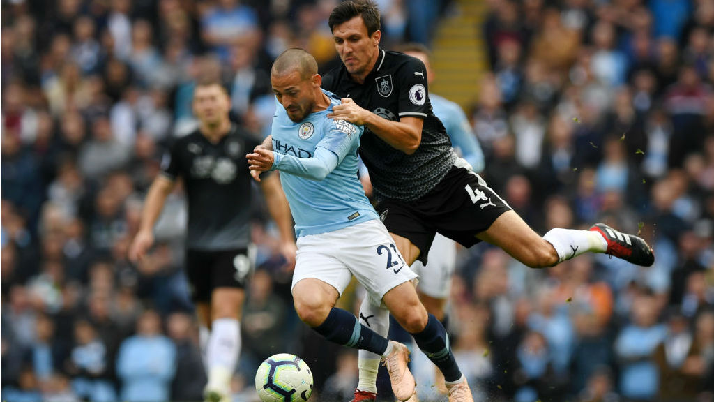 SOLID SILVA : David Silva looks to wriggle free from Burnley's Jack Crok