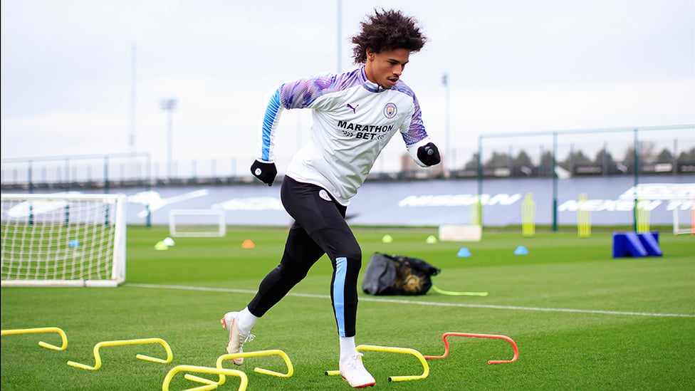 STEP TO IT : Sane is a study in concentration during this fitness drill