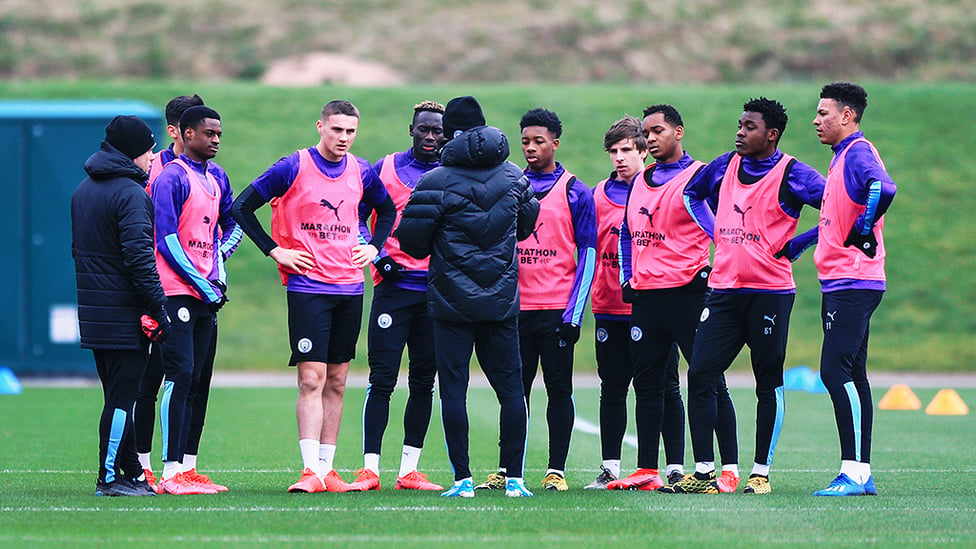 YOUTH :  Pep Guardiola addresses the lads from the Elite Development Squad.