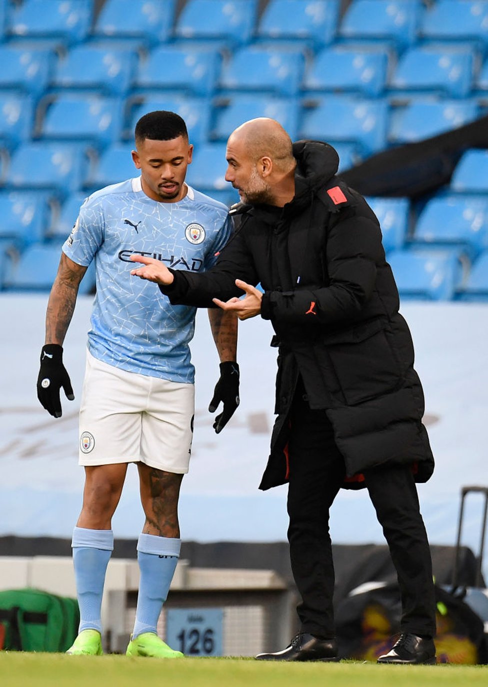 PEP TALK : The boss passes on some instructions to our Brazilian forward in the first half.