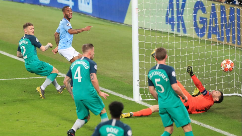 RIGHT ON TIME : Raheem Sterling makes no mistake as he pounces to score City's third goal