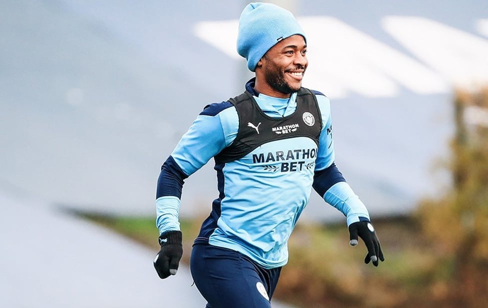 RARING RAHEEM : Raheem Sterling wrapped up for the cold Manchester weather