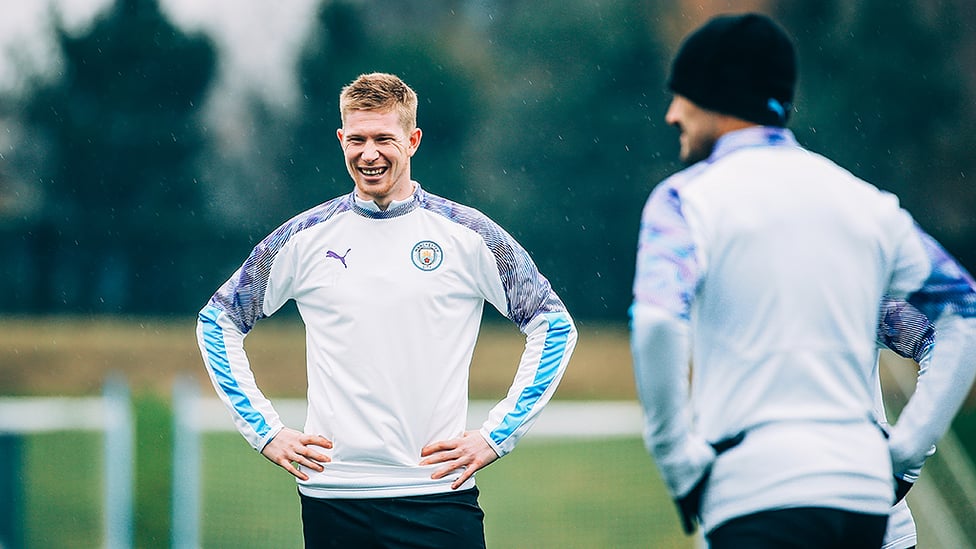 RAIN MAN : Kevin De Bruyne sees the funny side during a break in training