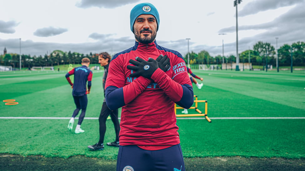 THAT'S A WRAP: Ilkay Gundogan wraps up warm for the session