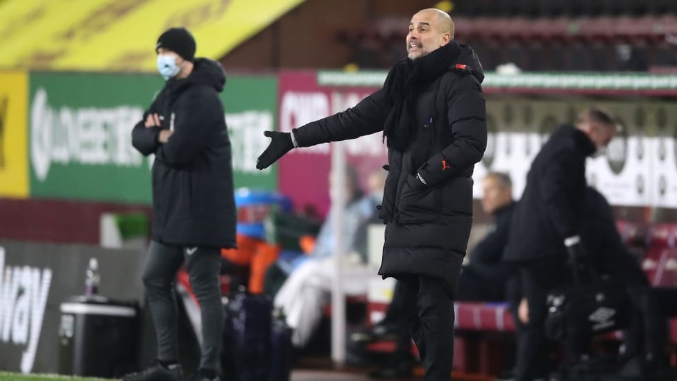 PEP TALK : The boss gives out his orders from the sideline.