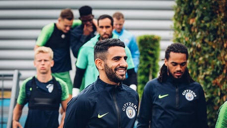 FOCUS: Riyad Mahrez heads out onto the training pitches with his new team mates.