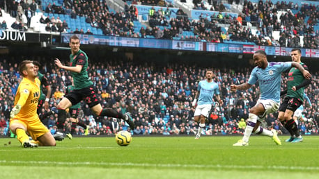 MAN ON FIRE: Raheem Sterling strikes a minute after the restart, firing into the near post