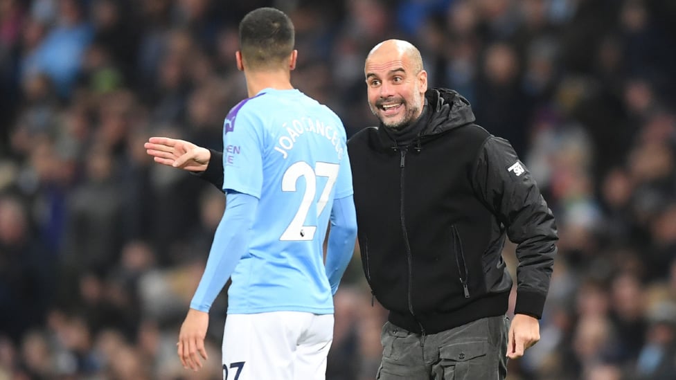 PEP TALK : Pep Guardiola delivers instructions to Joao Cancelo