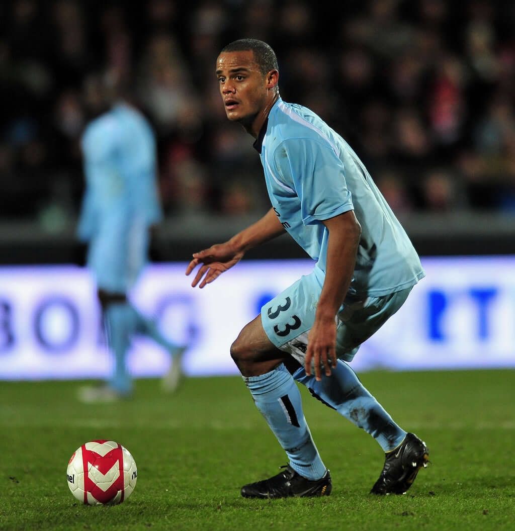 AALBORG, DENMARK - MARCH 19: Vincent Kompany of Manchester City runs with the ball during the UEFA Cup, Round of 16, Second Leg match between Aalborg and Manchester City on March 19, 2009 in Aalborg, Denmark. 