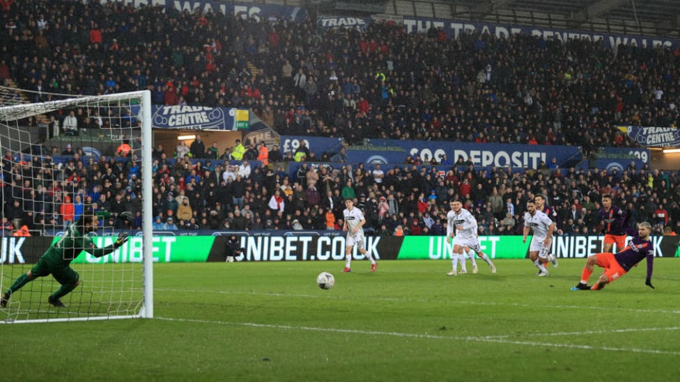 HIGH DRAMA : Kun's penalty goes in off the Swansea keeper's foot