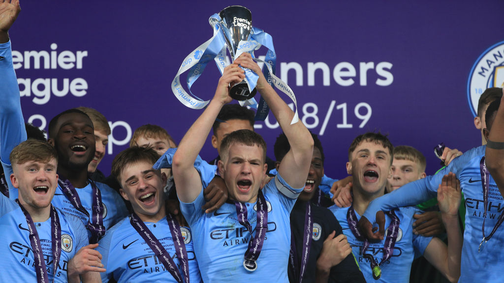 GLORY BOYS: Skipper Rowan McDonald lifts the Premier League U18 Cup aloft alongside his joyous City team-mates