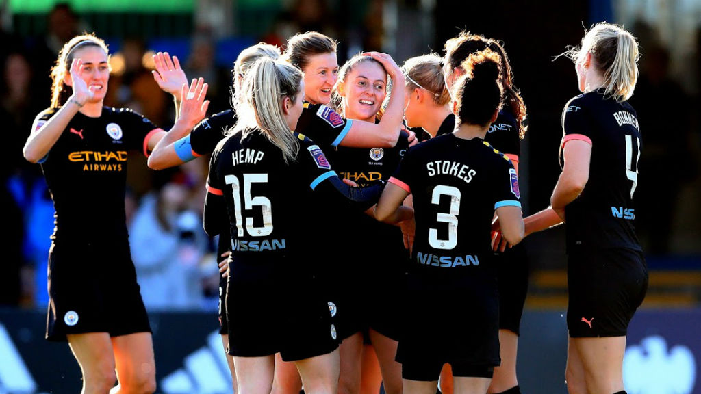 ALL SMILES: Keira Walsh celebrates with her City team mates after doubling our lead