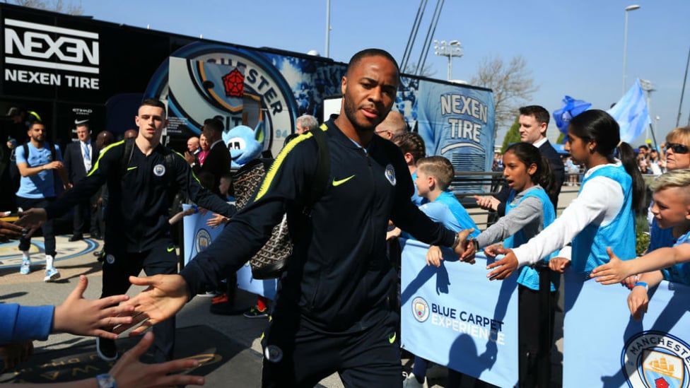 SUNNY SIDE UP : Raheem Sterling and Phil Foden exchange greetings with the fans as they arrive at the Etihad