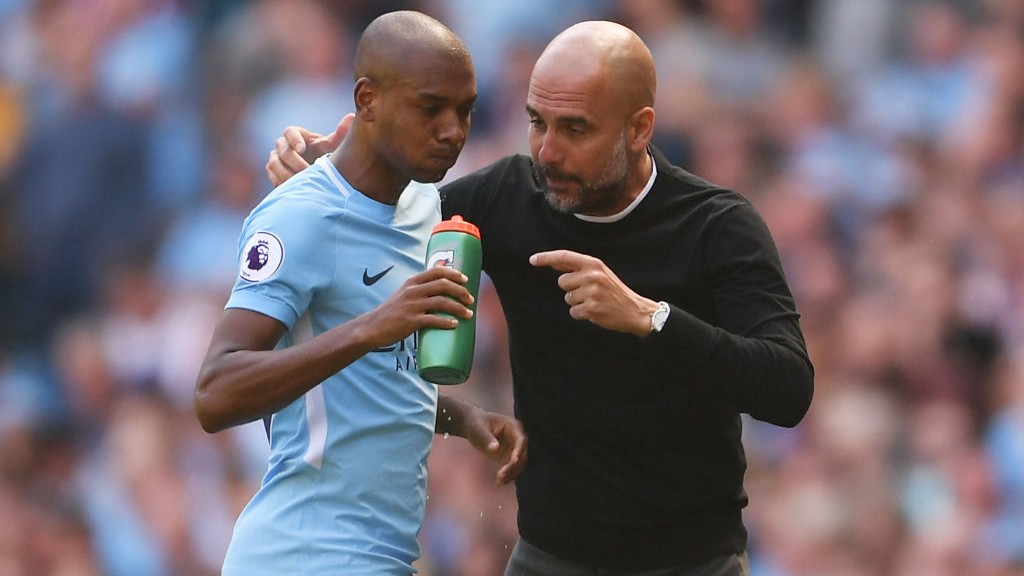 IN CONVERSATION: Pep Guardiola and Fernandinho.