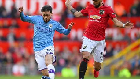 Bernardo Silva takes on Bruno Fernandes.