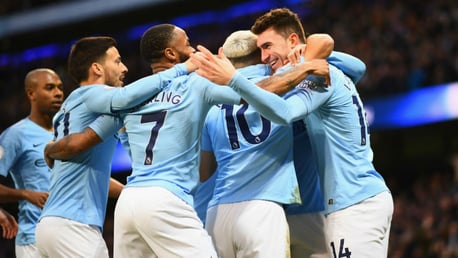 BLUES: The City players celebrate during the win over Arsenal