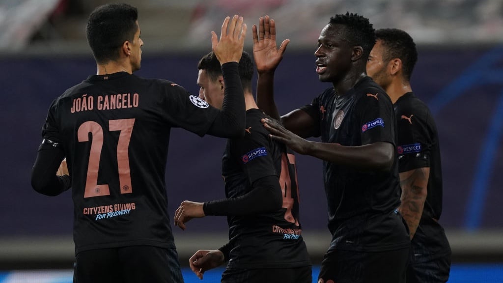 CELEBRATE: Mendy and Cancelo congratulate Foden.