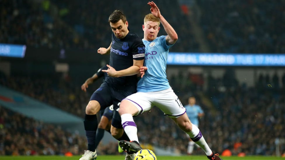 BATTLE : De Bruyne tussles for possession with Coleman in a tense first half.