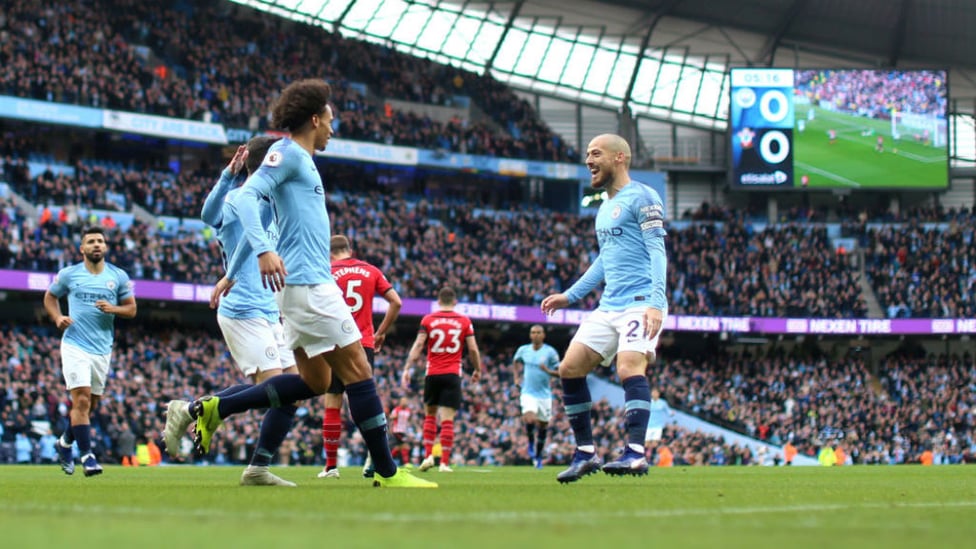 ALL SMILES : Leroy Sane and David Silva start the celebrations after City's opener