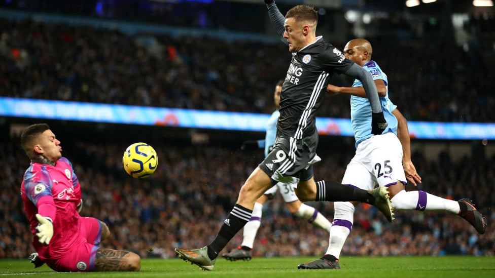 OPENER : Vardy clips the ball over Ederson to give Leicester the lead.