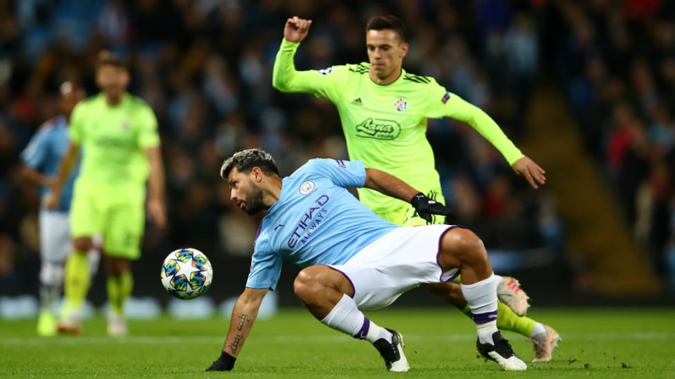 EARLY BATTLE : Aguero reacts quickly to regain possession from Marin Leovac