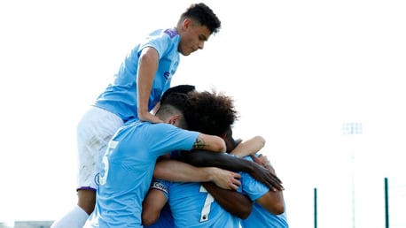 JUMPING FOR JOY: City U18s celebrate at the City Football Academy.
