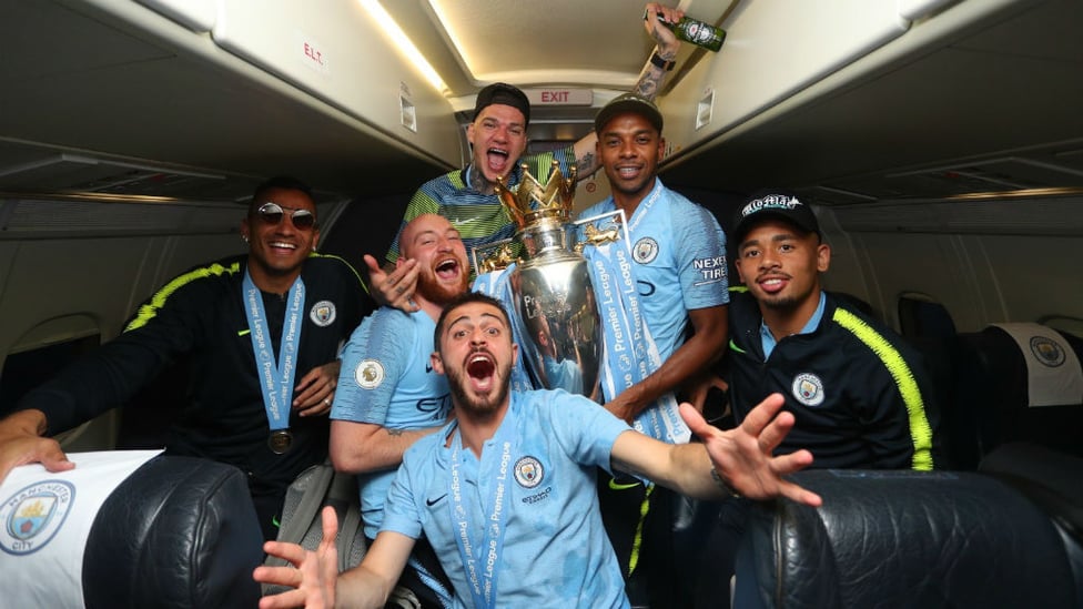 FLYING HIGH : Bernardo Silva and Co get in the title party spirit as City jet back to Manchester
