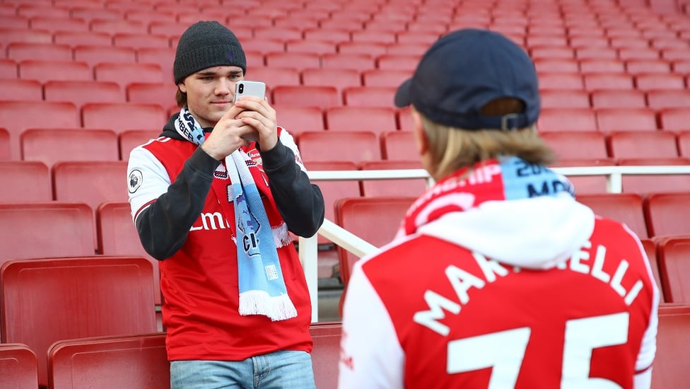 FRIENDLY FIRE? Arsenal fans with their friendship scarves before kick-off