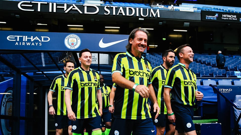 WALKING TALL : Ian Bishop leads the team out at the Etihad Stadium.