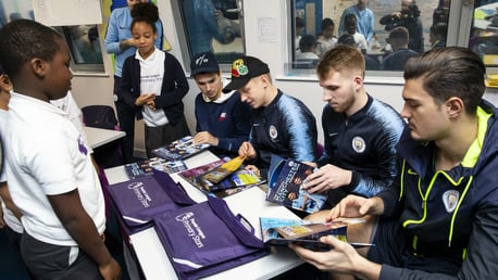 EXTRA RHYME: Manchester City players show poetry skills as they visit school for Premier League Writing Stars