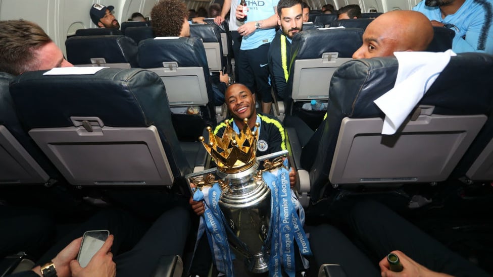 SITTING PRETTY : Raheem Sterling gets his hands on the trophy